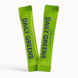 Two green packets of 'Daily Greens' on a white background